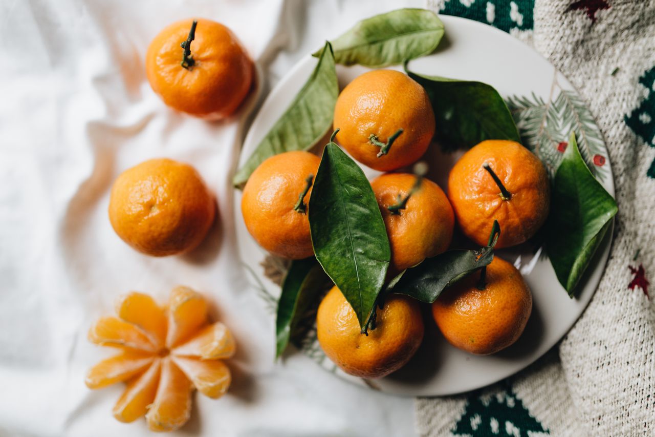 Still life of mandarin oranges with leaves